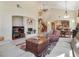 Open living area with vaulted ceilings and a fireplace at 1 Cerchio Basso, Henderson, NV 89011