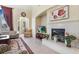 Comfortable living room with a fireplace and entertainment center at 1 Cerchio Basso, Henderson, NV 89011