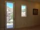 Bright interior view from a window and door; lush community and mountain views at 1 Cerchio Basso, Henderson, NV 89011