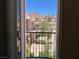 Exterior view from a balcony of community landscaping and homes with mountain views at 1 Cerchio Basso, Henderson, NV 89011
