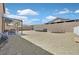 Spacious backyard featuring gravel, outdoor seating area, trampoline, and above-ground pool at 1020 High Altitude Ave, North Las Vegas, NV 89032