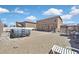 Gravel backyard with above ground pool, covered patio, and outdoor lounge area at 1020 High Altitude Ave, North Las Vegas, NV 89032