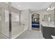 Bright bathroom featuring a soaking tub and a separate shower, complemented by modern fixtures and finishes at 1020 High Altitude Ave, North Las Vegas, NV 89032