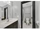 Modern bathroom with sleek fixtures, a well-lit mirror, and a separate toilet area for added privacy and convenience at 1020 High Altitude Ave, North Las Vegas, NV 89032