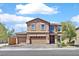 Two-story home featuring a three-car garage and well maintained landscape at 1020 High Altitude Ave, North Las Vegas, NV 89032