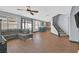 Open-concept living room with hardwood floors flowing into a spacious kitchen and dining area at 1020 High Altitude Ave, North Las Vegas, NV 89032