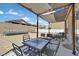 Inviting backyard patio with comfortable seating, perfect for outdoor dining and enjoying the serene surroundings at 1020 High Altitude Ave, North Las Vegas, NV 89032