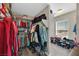 Spacious walk-in closet with ample shelving and hanging space, providing optimal organization and storage solutions at 1020 High Altitude Ave, North Las Vegas, NV 89032