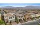 Panoramic aerial view showcasing neighborhood homes and mountain views at 10324 Stroma Ave, Las Vegas, NV 89166