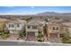 Expansive aerial view of a neighborhood showcasing multiple homes with well-maintained landscaping at 10324 Stroma Ave, Las Vegas, NV 89166