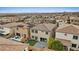 Aerial view of a backyard featuring a pool, lounge chairs, and a patio with artificial turf at 10324 Stroma Ave, Las Vegas, NV 89166