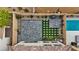 Aerial view of a beautifully landscaped backyard with a pool, patio, and artificial turf at 10324 Stroma Ave, Las Vegas, NV 89166