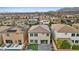 Aerial view of a backyard featuring a pool, lounge chairs, and a patio with artificial turf at 10324 Stroma Ave, Las Vegas, NV 89166