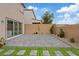 Spacious backyard featuring brick pavers, minimal landscaping, and a cozy ambiance at 10324 Stroma Ave, Las Vegas, NV 89166