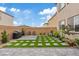 Landscaped backyard featuring a built-in grill, patio, and artificial turf at 10324 Stroma Ave, Las Vegas, NV 89166