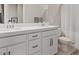 Modern bathroom with double sink vanity, white cabinetry, and contemporary fixtures at 10324 Stroma Ave, Las Vegas, NV 89166