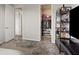 Bedroom view showcasing a closet with clothes and shelving, adjacent to a display shelf at 10324 Stroma Ave, Las Vegas, NV 89166