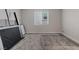 Empty bedroom featuring a large window and gray carpet at 10324 Stroma Ave, Las Vegas, NV 89166