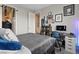 Comfortable bedroom showcasing modern decor, a grey color scheme, and a dedicated workspace at 10324 Stroma Ave, Las Vegas, NV 89166