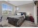 Bright secondary bedroom with a large window and an ensuite bathroom at 10324 Stroma Ave, Las Vegas, NV 89166