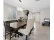 Bright dining room with stylish chandelier, stairs to the second level and great lighting at 10324 Stroma Ave, Las Vegas, NV 89166