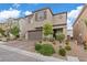 Charming two-story home featuring a brick driveway and well-manicured landscaping at 10324 Stroma Ave, Las Vegas, NV 89166