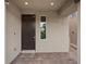 Inviting front entrance with a brown door, brick walkway, and modern exterior at 10324 Stroma Ave, Las Vegas, NV 89166