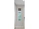 Hallway features natural lighting and clean sightlines to nearby rooms at 10324 Stroma Ave, Las Vegas, NV 89166