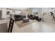 Open concept living room with plenty of natural light, flowing into the kitchen at 10324 Stroma Ave, Las Vegas, NV 89166