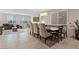Open concept living room and dining area with natural light and plenty of seating at 10324 Stroma Ave, Las Vegas, NV 89166