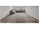 Large upstairs living room with gray carpet and a sectional couch at 10324 Stroma Ave, Las Vegas, NV 89166