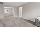 Spacious living room with gray carpet and neutral paint at 10324 Stroma Ave, Las Vegas, NV 89166