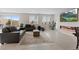 Open concept living room with linear fireplace and access to an outdoor patio space at 10324 Stroma Ave, Las Vegas, NV 89166