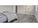 Large main bedroom with plush carpeting and an ensuite bathroom at 10324 Stroma Ave, Las Vegas, NV 89166