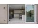 View from patio doors looking into modern kitchen and living room at 10324 Stroma Ave, Las Vegas, NV 89166