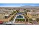 Community playground with a covered play structure and lush landscaping in a residential area at 10324 Stroma Ave, Las Vegas, NV 89166