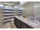 Bathroom featuring a double sink vanity with granite countertops and a striped shower curtain at 10623 Auburn Springs Ave, Las Vegas, NV 89166