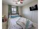 Comfortable bedroom featuring natural light, calming green accents, and a well-lit atmosphere at 10623 Auburn Springs Ave, Las Vegas, NV 89166