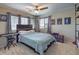 Cozy bedroom featuring a comfortable bed, natural light from windows, and stylish decor at 10623 Auburn Springs Ave, Las Vegas, NV 89166
