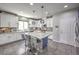 Modern kitchen featuring stylish island seating, stainless appliances, and granite countertops at 10623 Auburn Springs Ave, Las Vegas, NV 89166