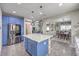 Bright kitchen featuring stainless appliances, blue accents, and a central island at 10623 Auburn Springs Ave, Las Vegas, NV 89166