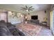 Expansive living area enhanced by sleek tile floors, a ceiling fan, and abundant natural light at 10623 Auburn Springs Ave, Las Vegas, NV 89166