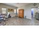 Comfortable living room with tile flooring, neutral tones, and view to a bathroom at 10623 Auburn Springs Ave, Las Vegas, NV 89166