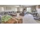 Bright living room with two gray sofas, large windows, and a comfortable reading area at 10623 Auburn Springs Ave, Las Vegas, NV 89166