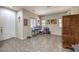 Well-lit living room features neutral tones, tile flooring, and a versatile layout at 10623 Auburn Springs Ave, Las Vegas, NV 89166