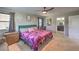 Bright main bedroom with a plush bed, ample natural light, and an ensuite bathroom at 10623 Auburn Springs Ave, Las Vegas, NV 89166
