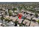 A high aerial view that shows a lush neighborhood with beautiful houses and well-maintained landscaping at 10805 Hollow Creek Ln, Las Vegas, NV 89144