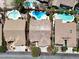 A captivating aerial shot highlighting the backyard pool and outdoor living space of the home at 10805 Hollow Creek Ln, Las Vegas, NV 89144