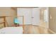 Bedroom with bunkbed, closet and access to the hallway with matching light wood flooring throughout at 10805 Hollow Creek Ln, Las Vegas, NV 89144