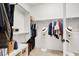 Walk in closet has built in shelving and hanging racks for optimal storage and organization at 10805 Hollow Creek Ln, Las Vegas, NV 89144